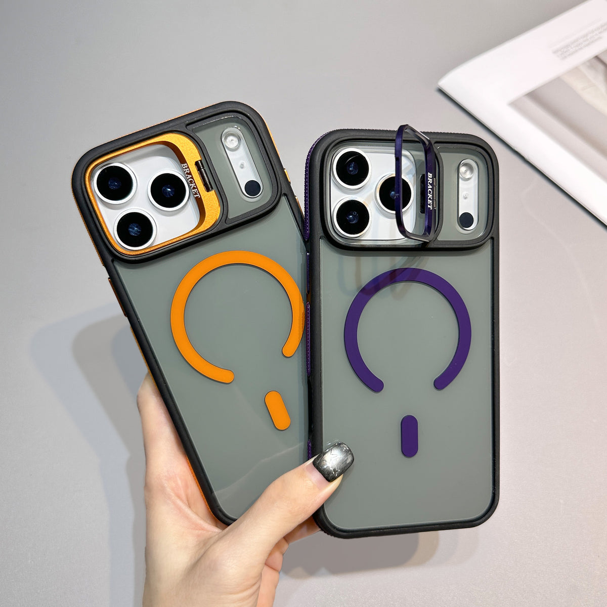 This sleek iPhone case combines modern style with everyday protection. Featuring a durable dark frame, a translucent matte back, and a bold magnetic ring design, it offers a clean, premium look while supporting MagSafe accessories. The raised camera frame adds extra protection for your lenses, helping keep your phone stylish and secure wherever you go.